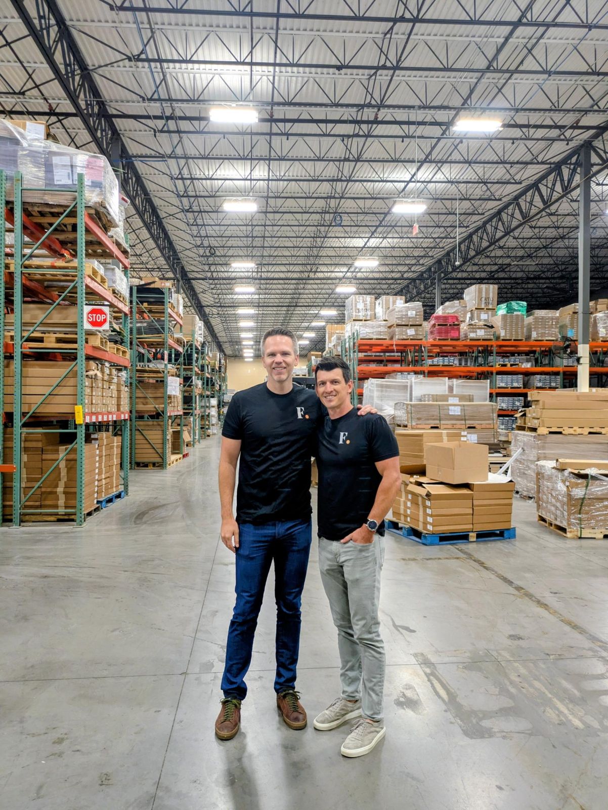 Clint Mickle (left) and Neal Puckett pose on the floor of their Grapevine warehouse.